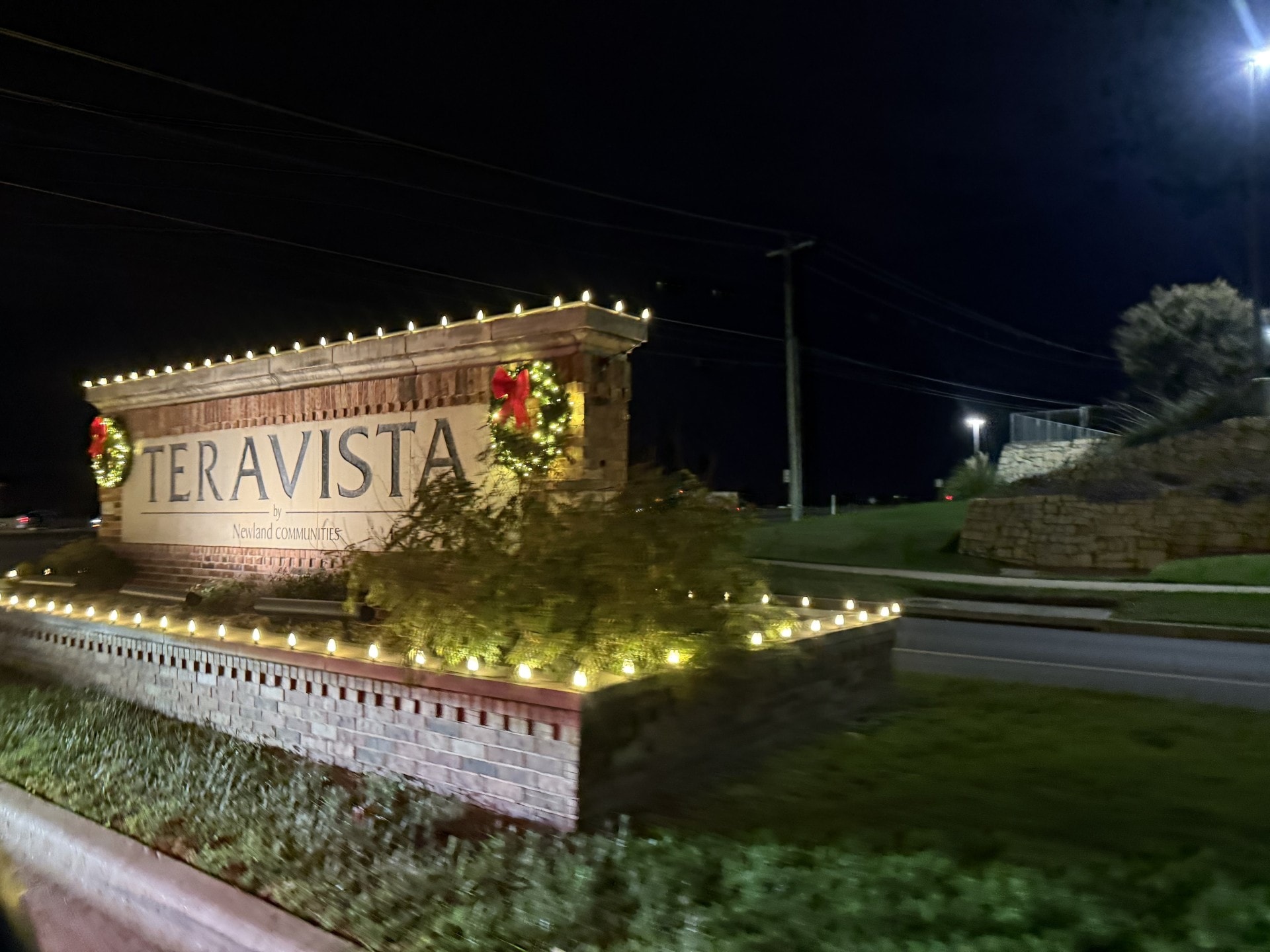 Luxury home roofline Christmas lights at night